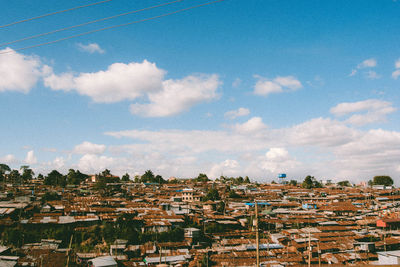 Townscape against cloudy sky