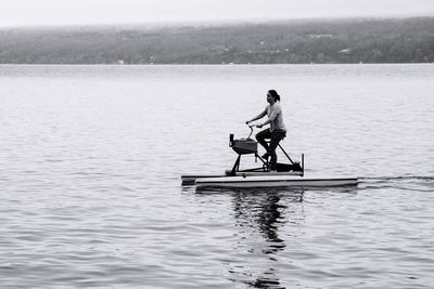Woman on water bike in lake