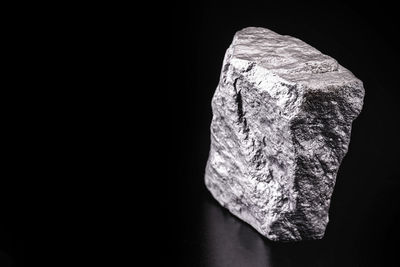 Close-up of rock against black background