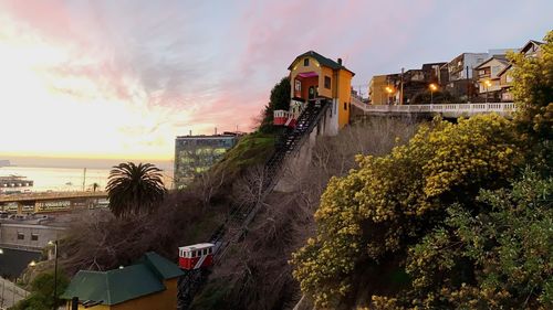 High angle view of illuminated buildings against sky during sunset