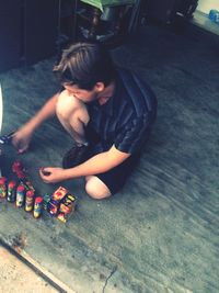 High angle view of boy playing on floor