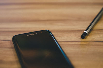 High angle view of smart phone on table