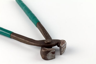 High angle view of rusty metal against white background