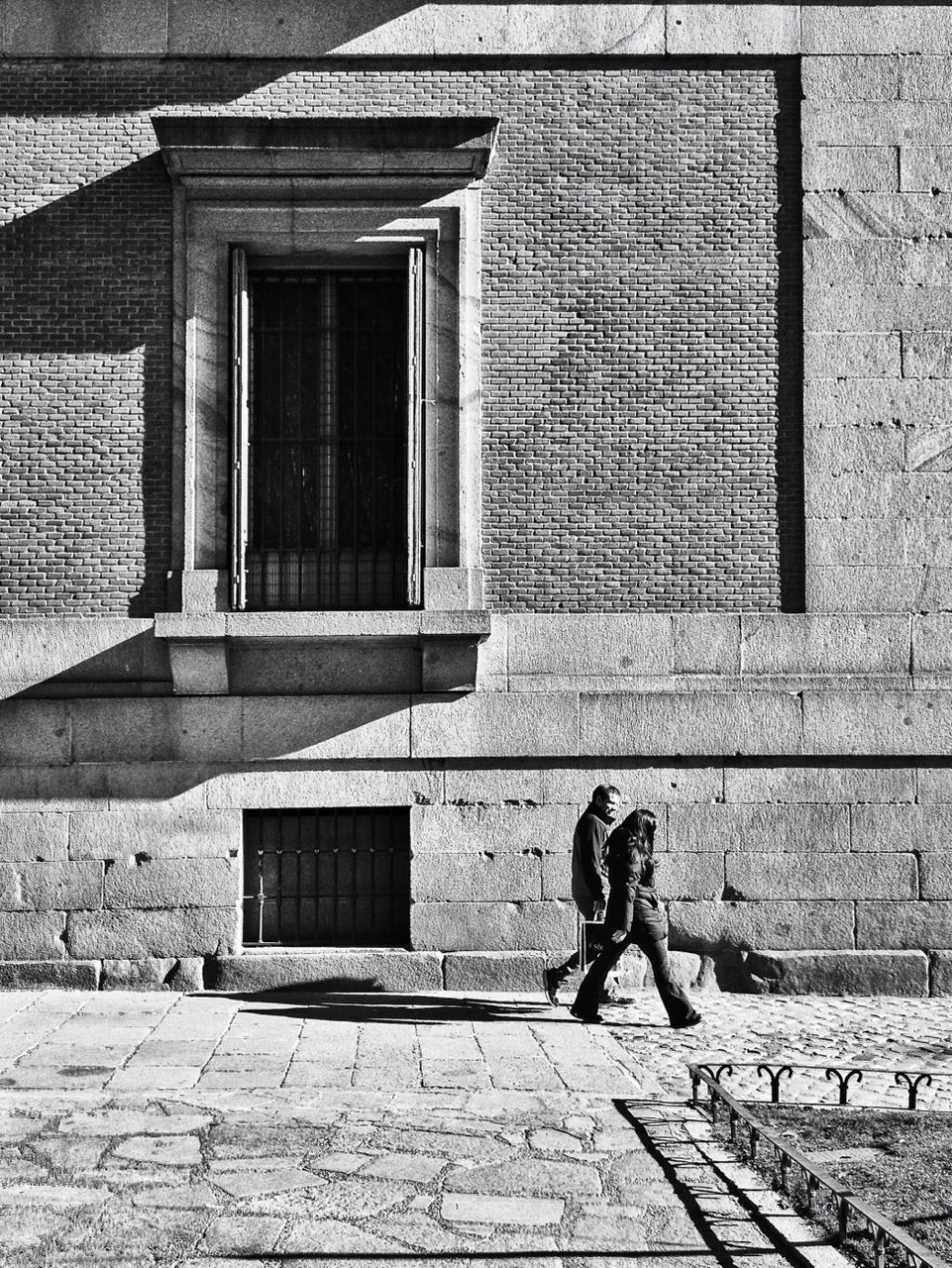 building exterior, architecture, built structure, brick wall, window, wall - building feature, bicycle, wall, cobblestone, house, day, sidewalk, sunlight, shadow, closed, building, door, outdoors, residential structure, street