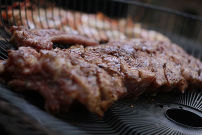 Close-up of meat on barbecue grill