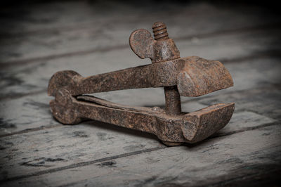 Close-up of rusty metal on table