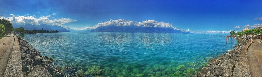 Scenic view of sea against blue sky