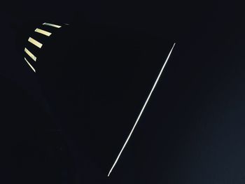 Windmill against clear sky at night