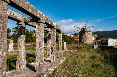 Built structure on landscape against sky