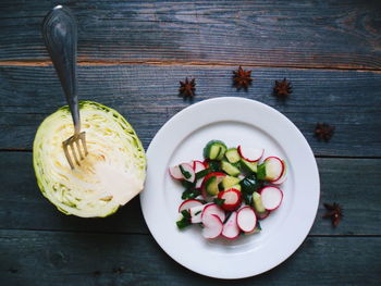 High angle view of fruits in plate on table