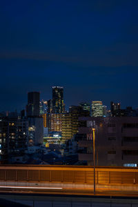 Illuminated buildings in city at night