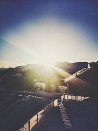 Scenic view of buildings against sky on sunny day