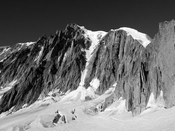 Panoramic view of snowcapped mountains against sky