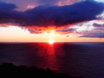 Scenic view of sea against romantic sky at sunset