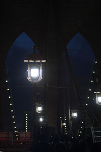 Low angle view of illuminated street light at night