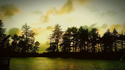 Scenic view of lake against cloudy sky