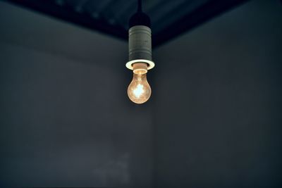 Close-up of light bulb hanging
