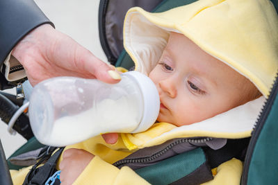 High angle view of cute girl drinking milk