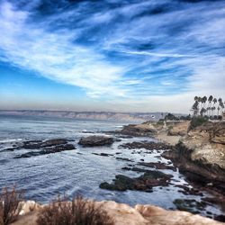 Scenic view of sea against cloudy sky