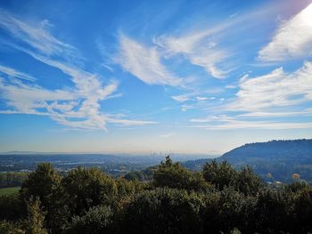 Scenic view of landscape against blue sky