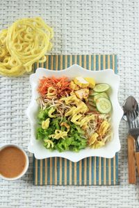 Asinan betawi. indonesian raw vegetable and yellow tofu bean curd with tangy peanut dressing 