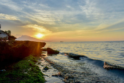 Scenic view of sea against sky during sunset