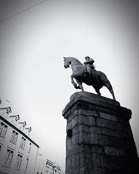 Low angle view of statue against sky