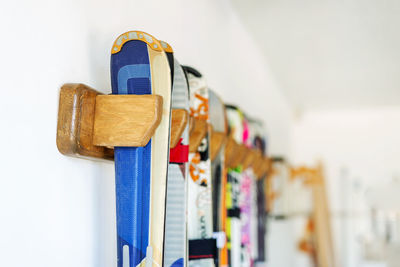 Colorful objects in row on wall
