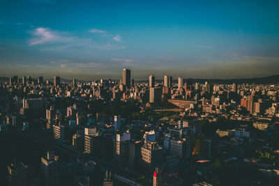 Aerial view of modern buildings in city against sky