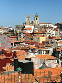 Houses in town against clear sky