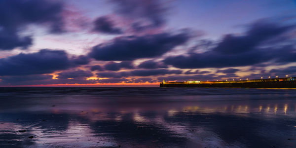 Scenic view of sea against dramatic sky