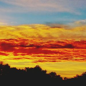 Scenic view of dramatic sky at sunset