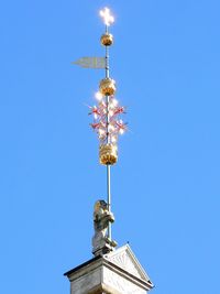 Low angle view of built structure against clear blue sky