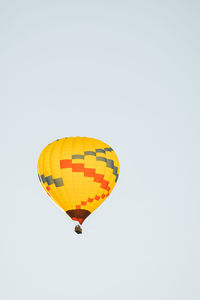 Low angle view of hot air balloons against clear sky