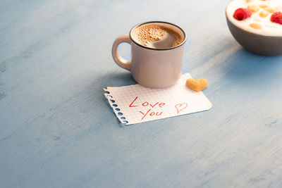 High angle view of coffee cup on table