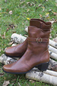 Close-up of shoes on field