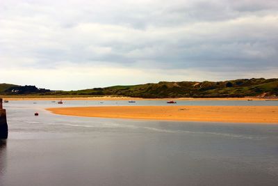 Scenic view of beach against sky