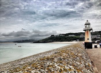 Scenic view of sea against cloudy sky