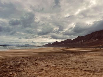 Scenic view of beach against sky in fuerteventura. star wars han solo set.