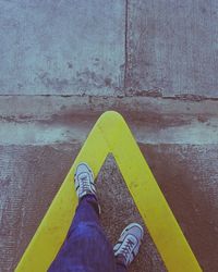 Low section of person standing on street