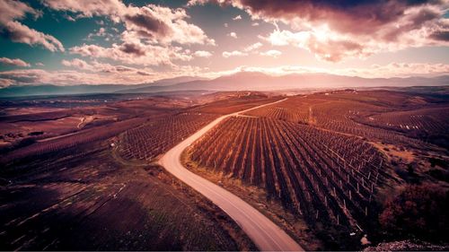 High angle view of field against sky during sunset