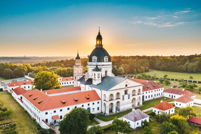 Aerial view of church against sky at sunset