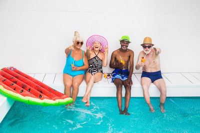 High angle view of female friends in swimming pool