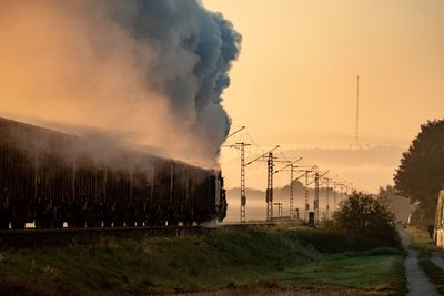 Train on railroad track against sky