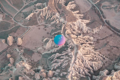 High angle view of ballon over rugged mountains