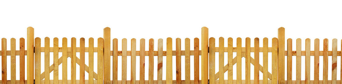 Close-up of wooden fence against white background