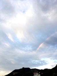 Low angle view of rainbow against sky