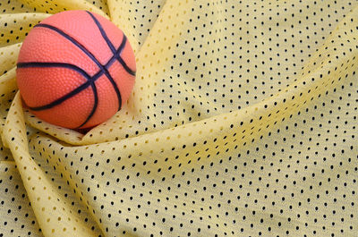 High angle view of basketball on fabric