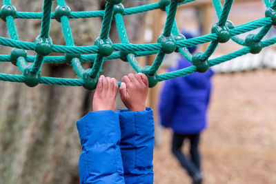 People playing on rope in playground