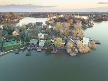 High angle view of lake by buildings in city